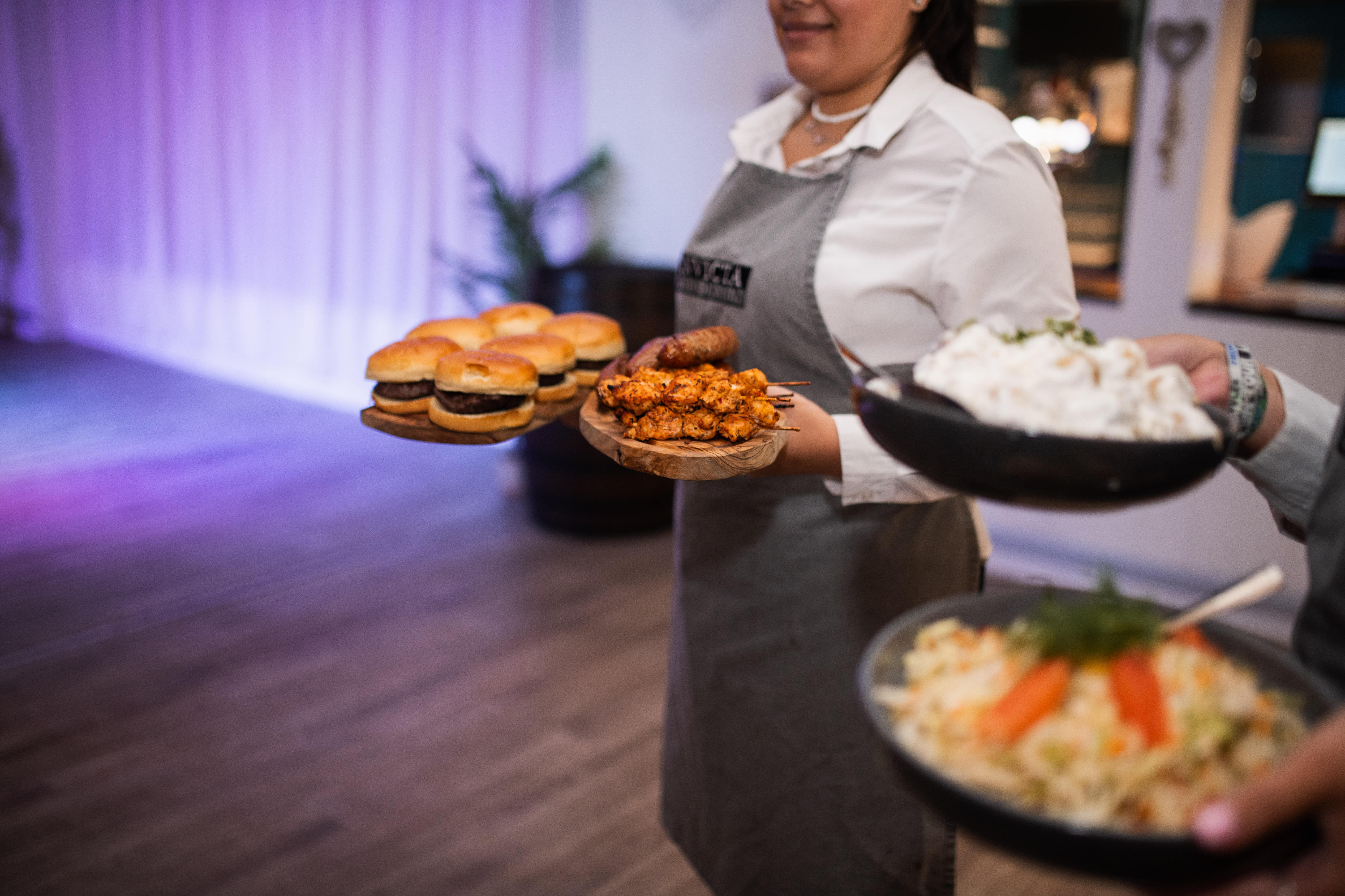 Festival wedding food being taken out to the wedding guests at Solton Manor