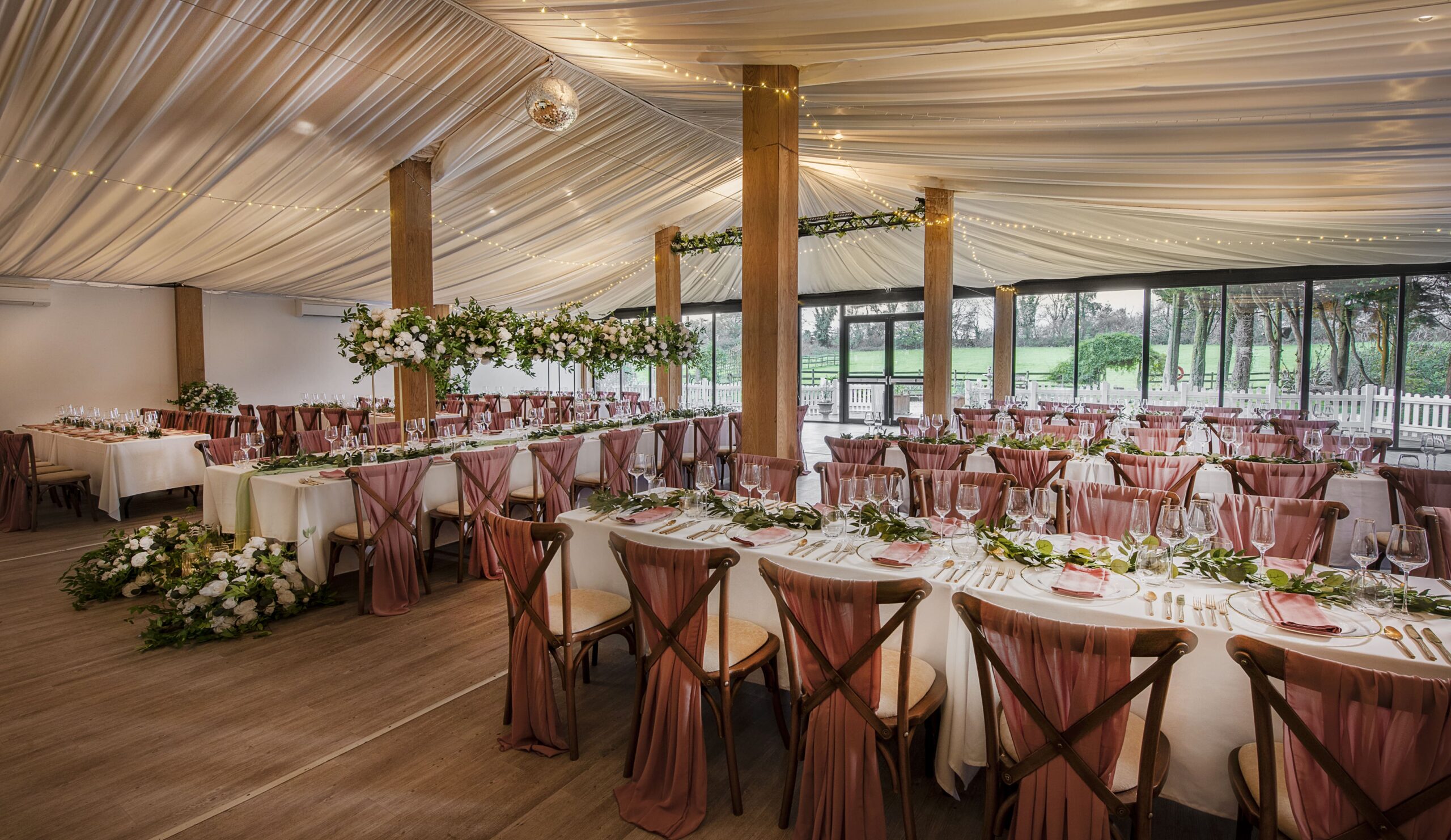Wedding tables set up in the Dutch Barn at Solton Manor