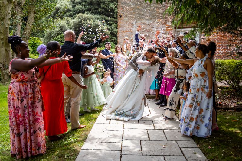 A confetti and drop kiss at Solton Manor, near Whitstable, Kent, England