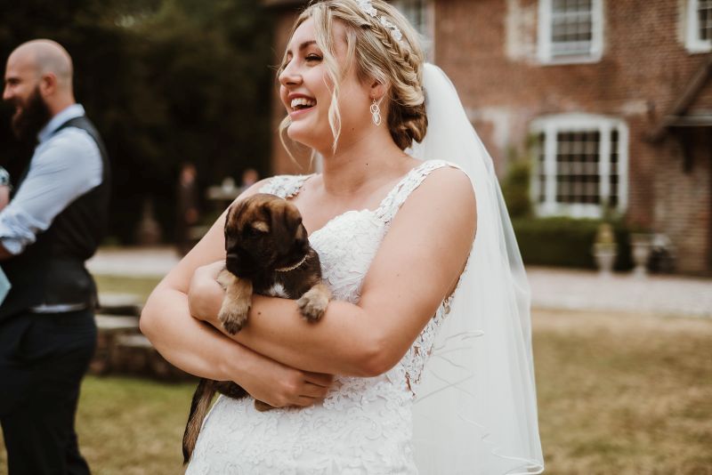 An image of a bride on the lawns at Solton Manor a pet friendly wedding venue in Kent near Dover