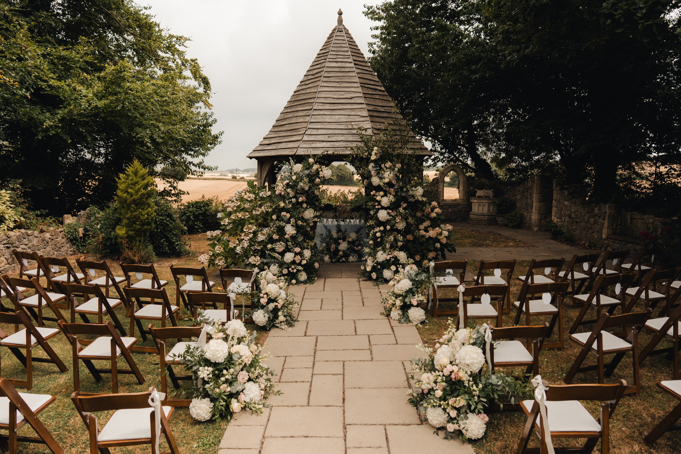 the licenced outdoor ceremony space in godric's garden at solton manor, near dover, kent, england